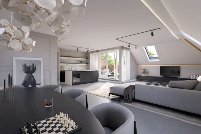 Impressie van een woonkamer met dakraam in een appartement in Eerde